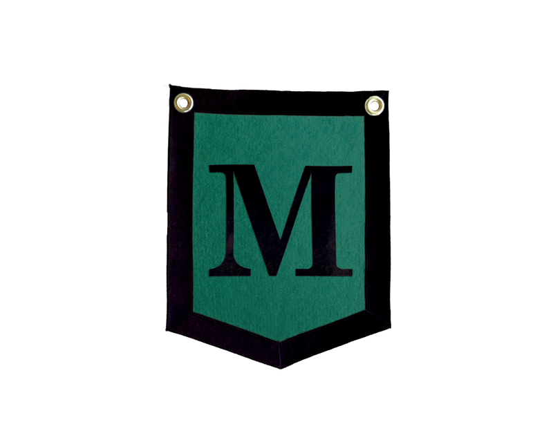 a black and green chevron shaped banner with the letter "M" on it