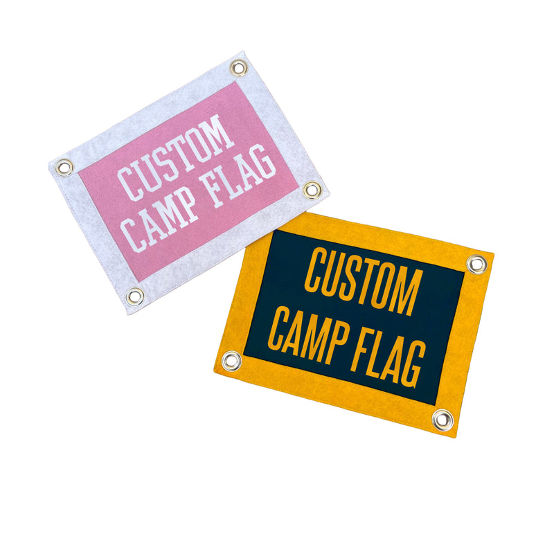 Two rectangular banners that say "Custom Camp Flag"