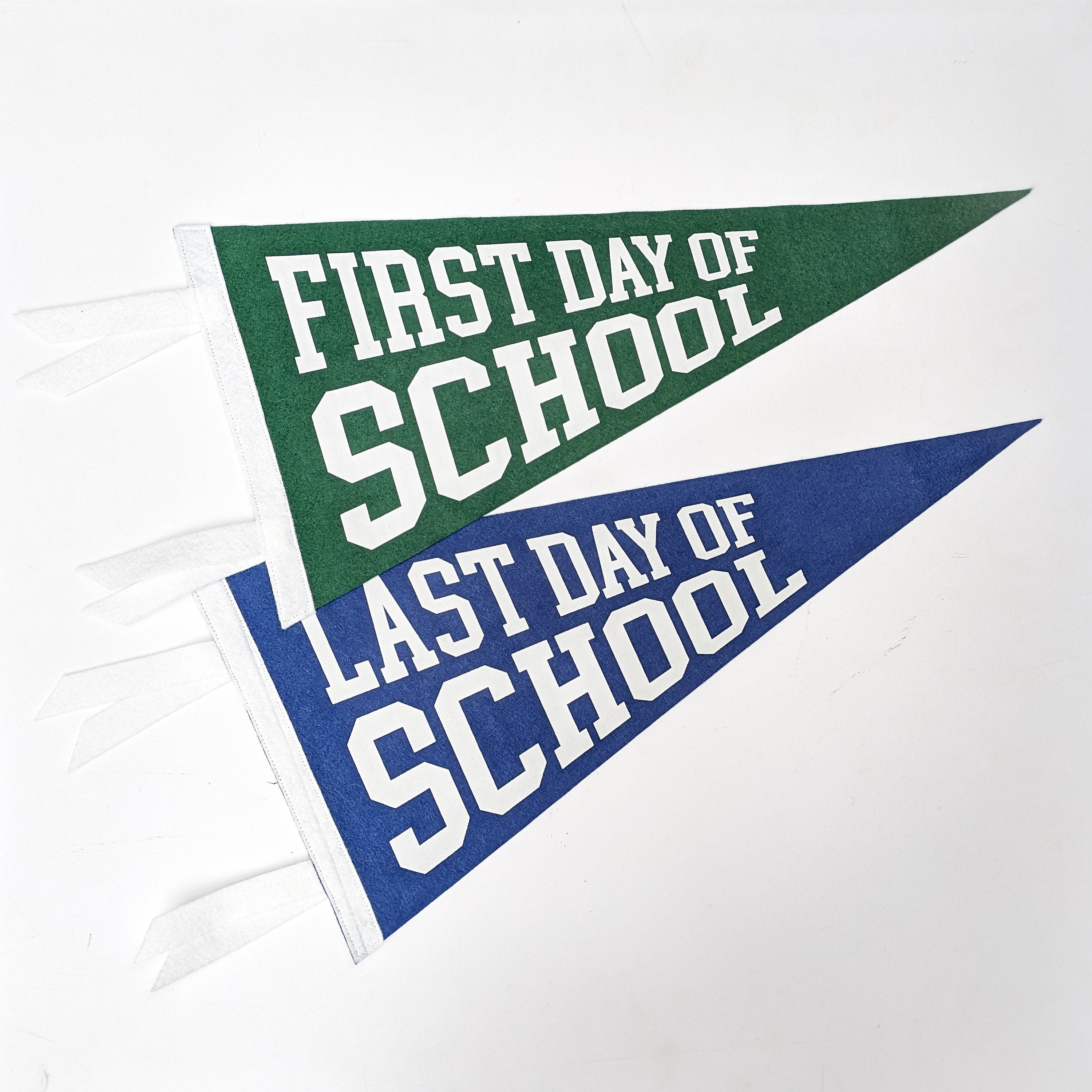 Two pennants with 'First Day of School' and 'Last Day of School' text on a white background.
