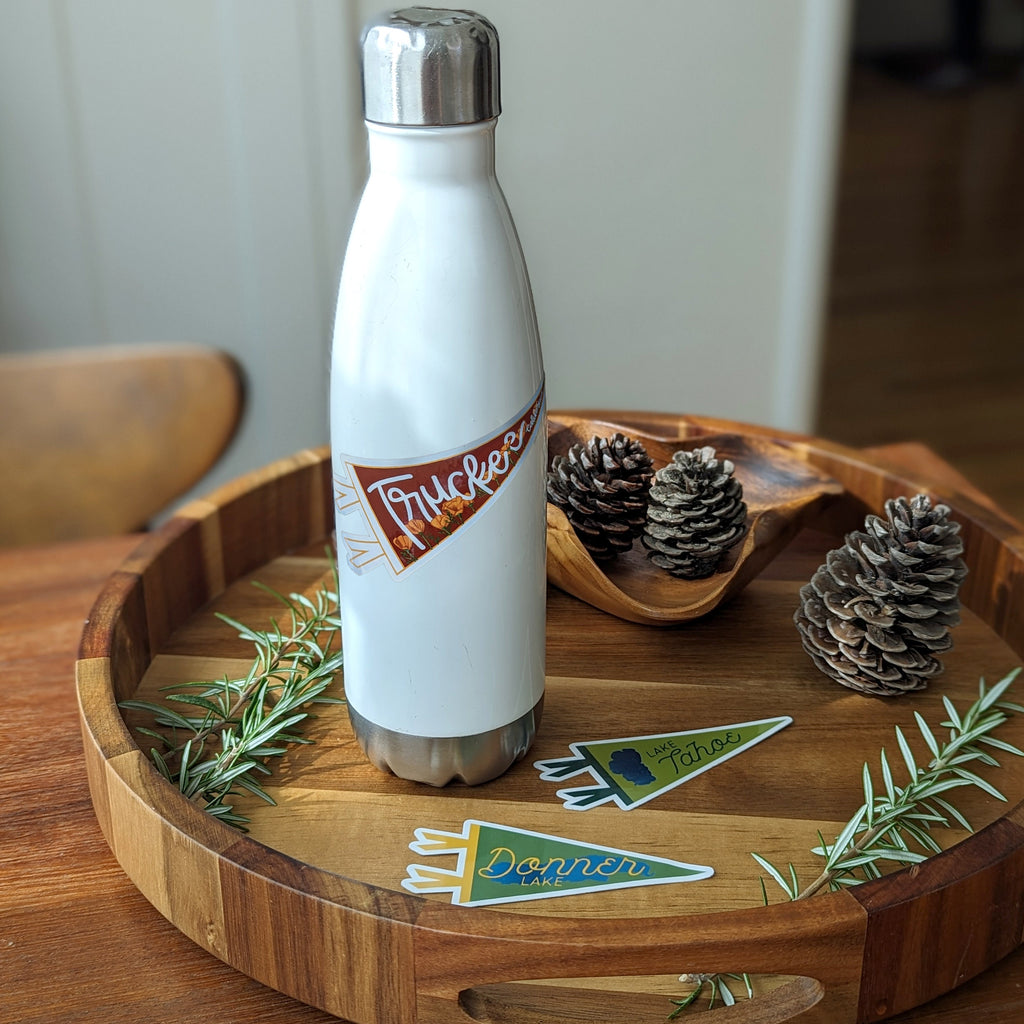 White insulated bottle with a Truckee pennant-shaped sticker