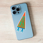 Phone case with 'Tummyache Survivor' pennant-shaped orange, green and blue sticker