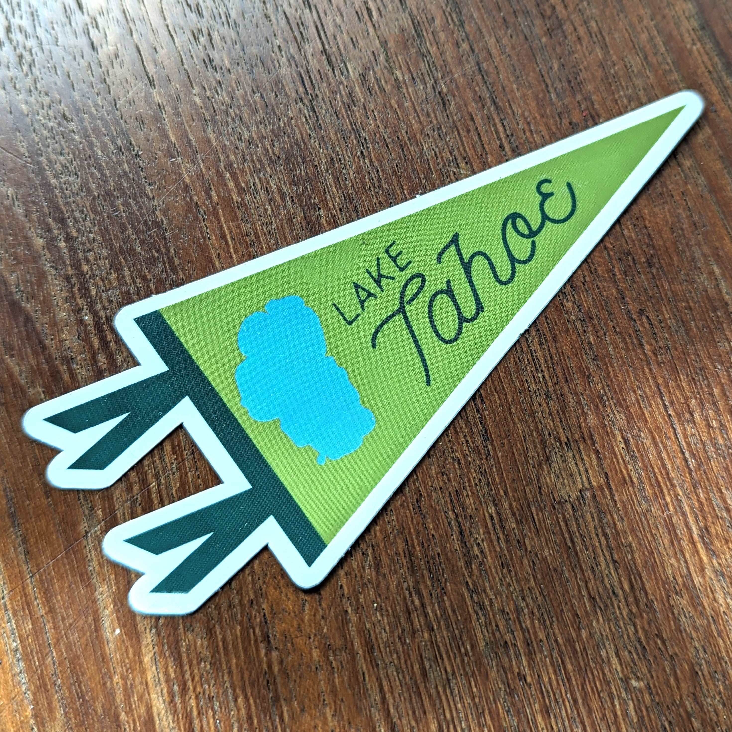 Lake Tahoe-themed sticker on a wooden surface